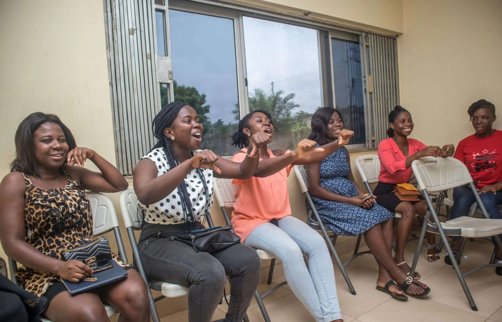 LIFT women laughing together at a GirlTalk session